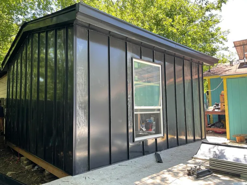 Black standing seam metal wall panels for Roof Inspection in Lindstrom